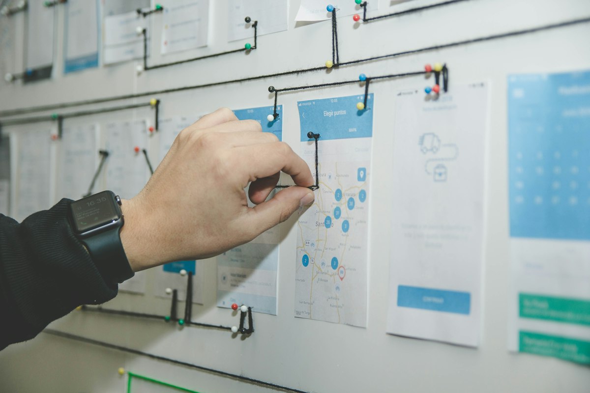 Website wireframes and interface design on a desk