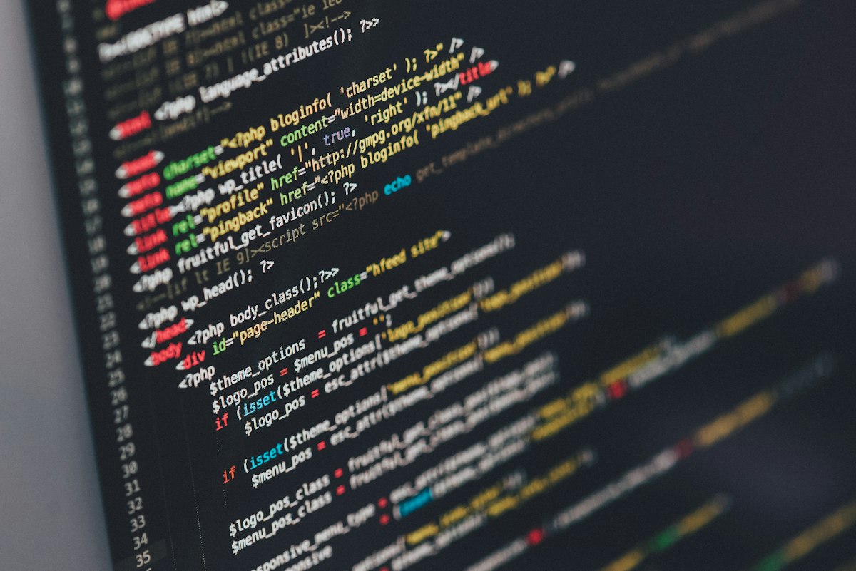Developer workstation with code on screen